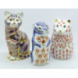 Three Royal Crown Derby paperweights, two with gold stoppers and cat with silver stopper