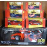 A Hot Wheels Racing model Michael Schumacher Ferrari and six other model Ferrari, all boxed