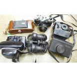 Five cameras and two pairs of field glasses