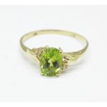 A 9ct gold, peridot and diamond ring, 1.1g, O