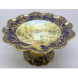 An Aynsley tazza, with a blue and gold border and decoration, having a central hand painted