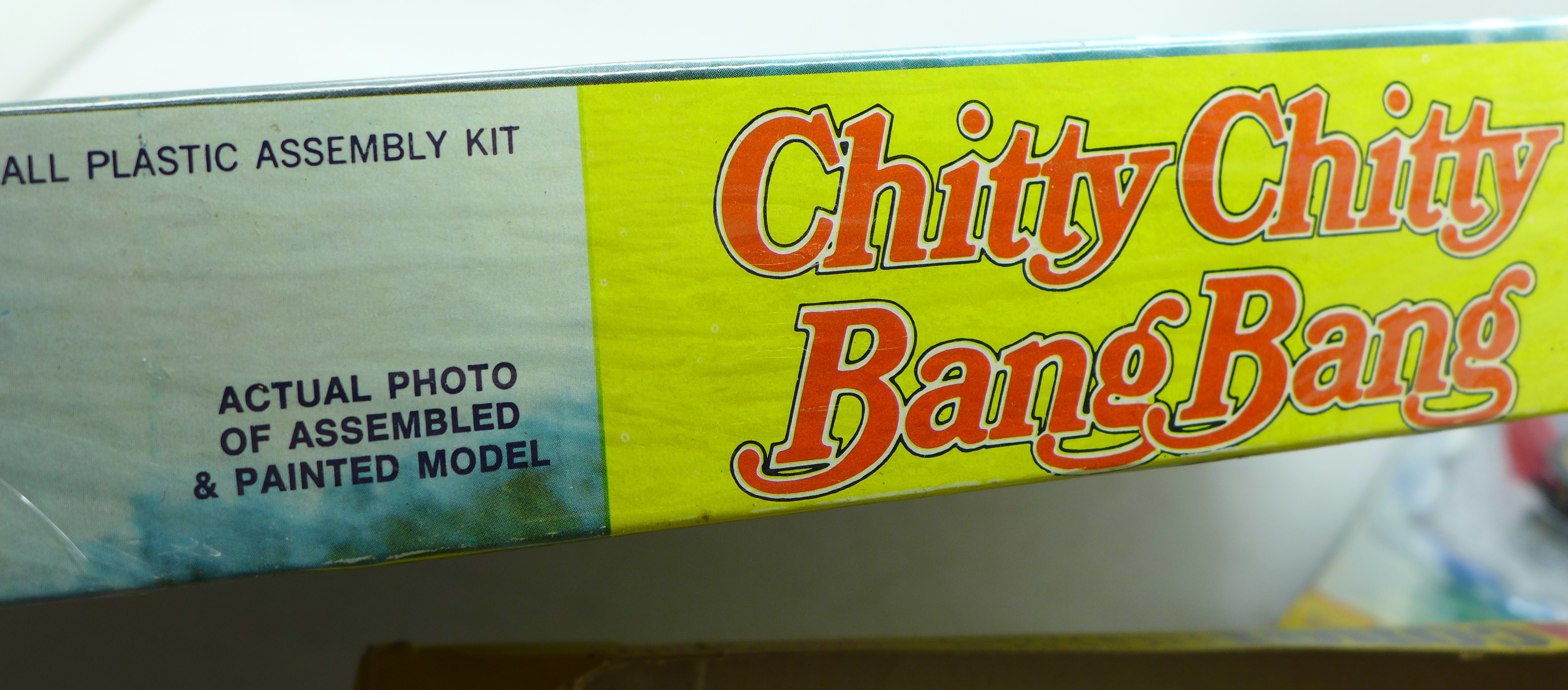 A Chitty Chitty Bang Bang poster, an Aurora model kit, a Corgi Toys model, a/f, and one other - Image 4 of 6