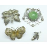 Three silver brooches and a single earring