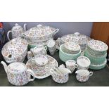 A large collection of Minton Haddon Hall tea and dinnerware, including three large tureens,