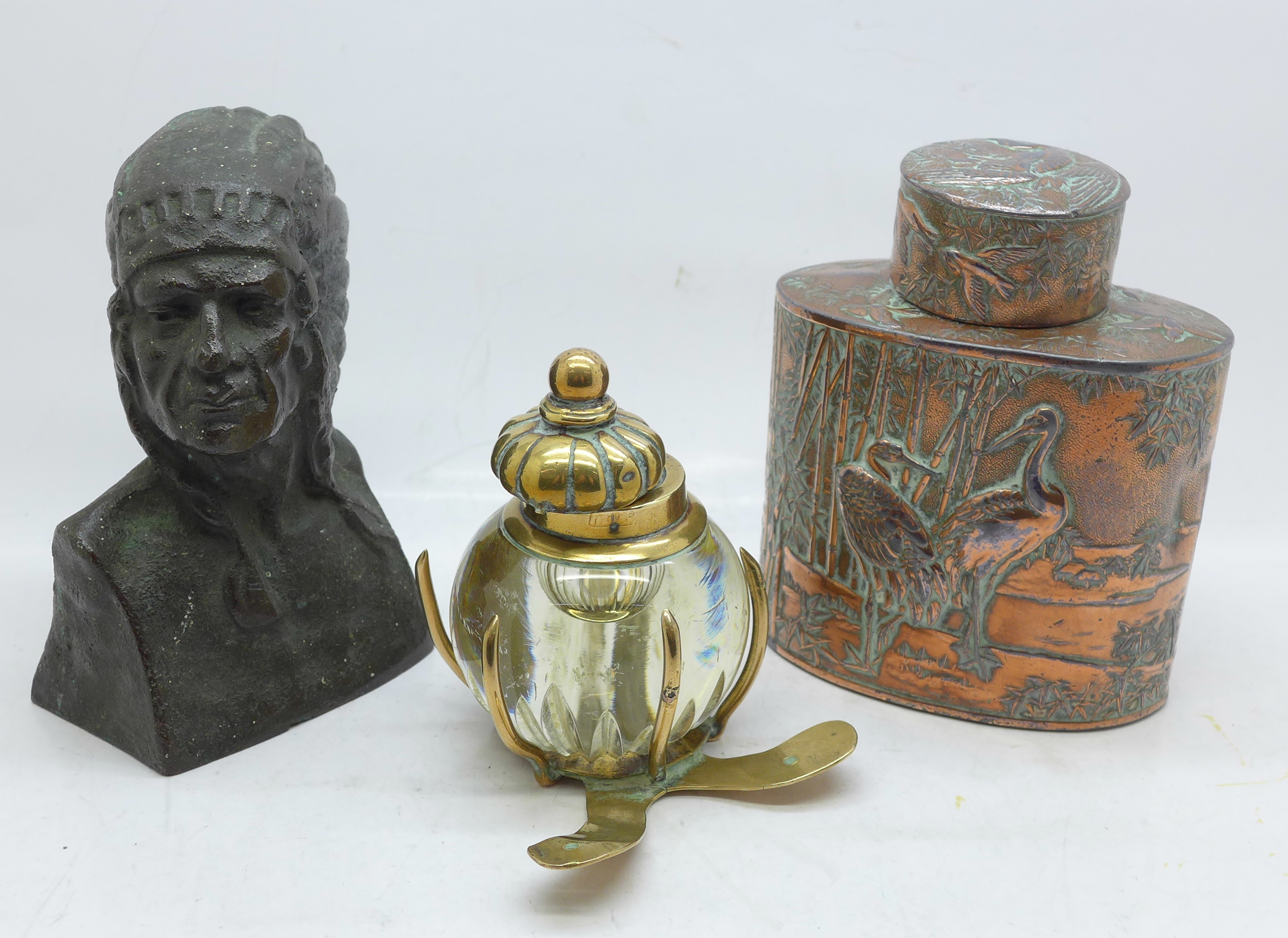 A Chinese embossed copper plated tea caddy, a bronze bust of a Native American and a brass and glass