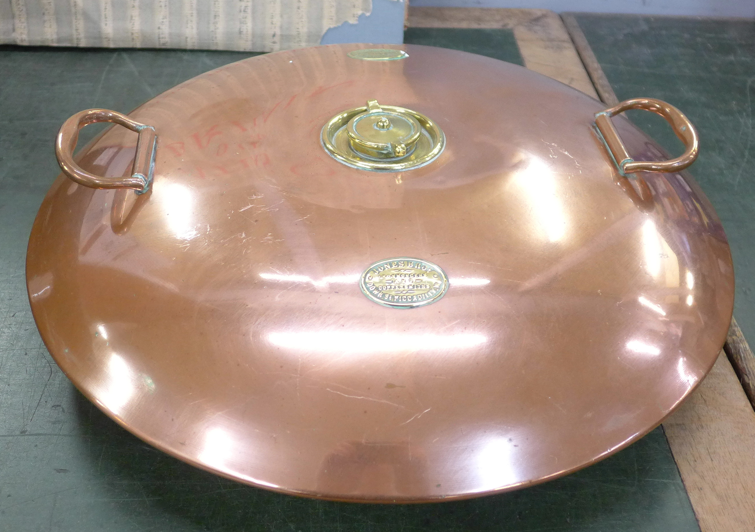 A Jones Bros brass and copper spherical warming pan