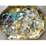 A tin of mixed costume jewellery, 1.70kg