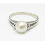 An 18ct white gold, pearl and diamond ring, 2.9g, Q