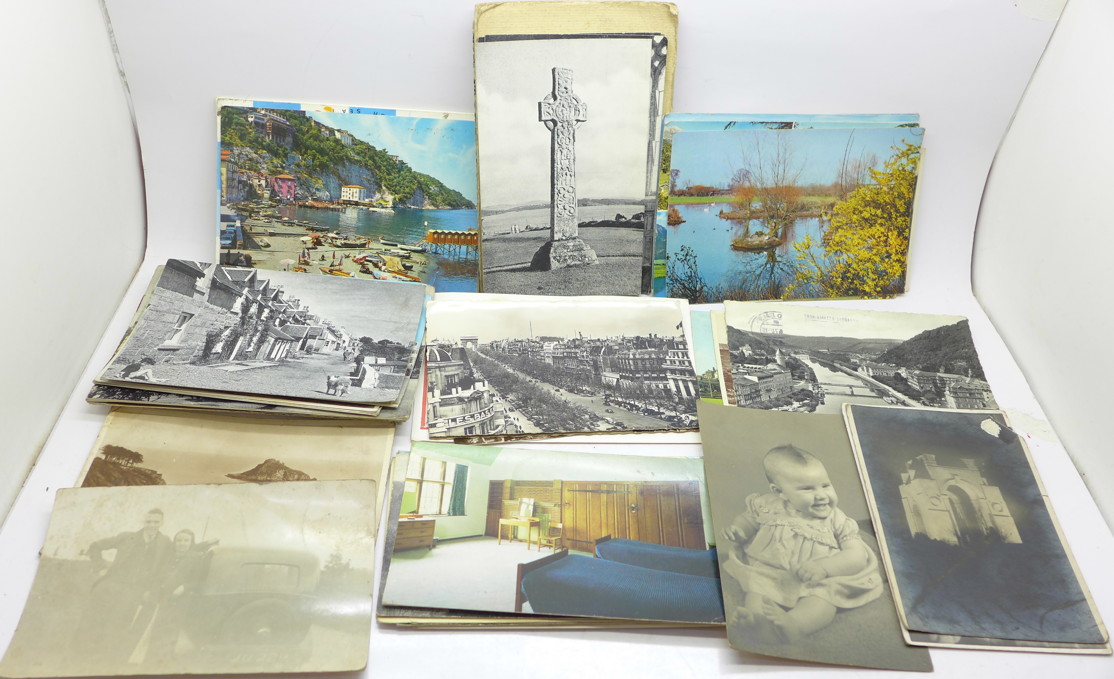 A collection of postcards and some photographs