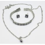 A diamond and sapphire set bracelet and pendant, and a pair of earrings set with blue and white