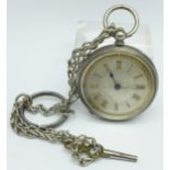 A silver fob watch with engraved landscape on dial, fitted case