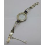 A silver and mother of pearl bracelet wristwatch