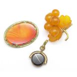 An amber brooch, a fob, etc.