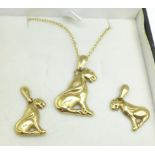 A 9ct gold Panther pendant and chain and matching earrings, boxed