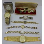 A small silver fronted clock, lady's and gentleman's wristwatches, including three Rotary, and two