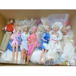 A box of 1980's Barbie dolls with clothes and accessories