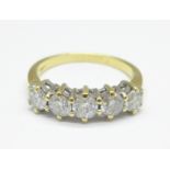 An 18ct gold and five stone diamond ring, 1.0carat marked on the shank, 3.5g, M