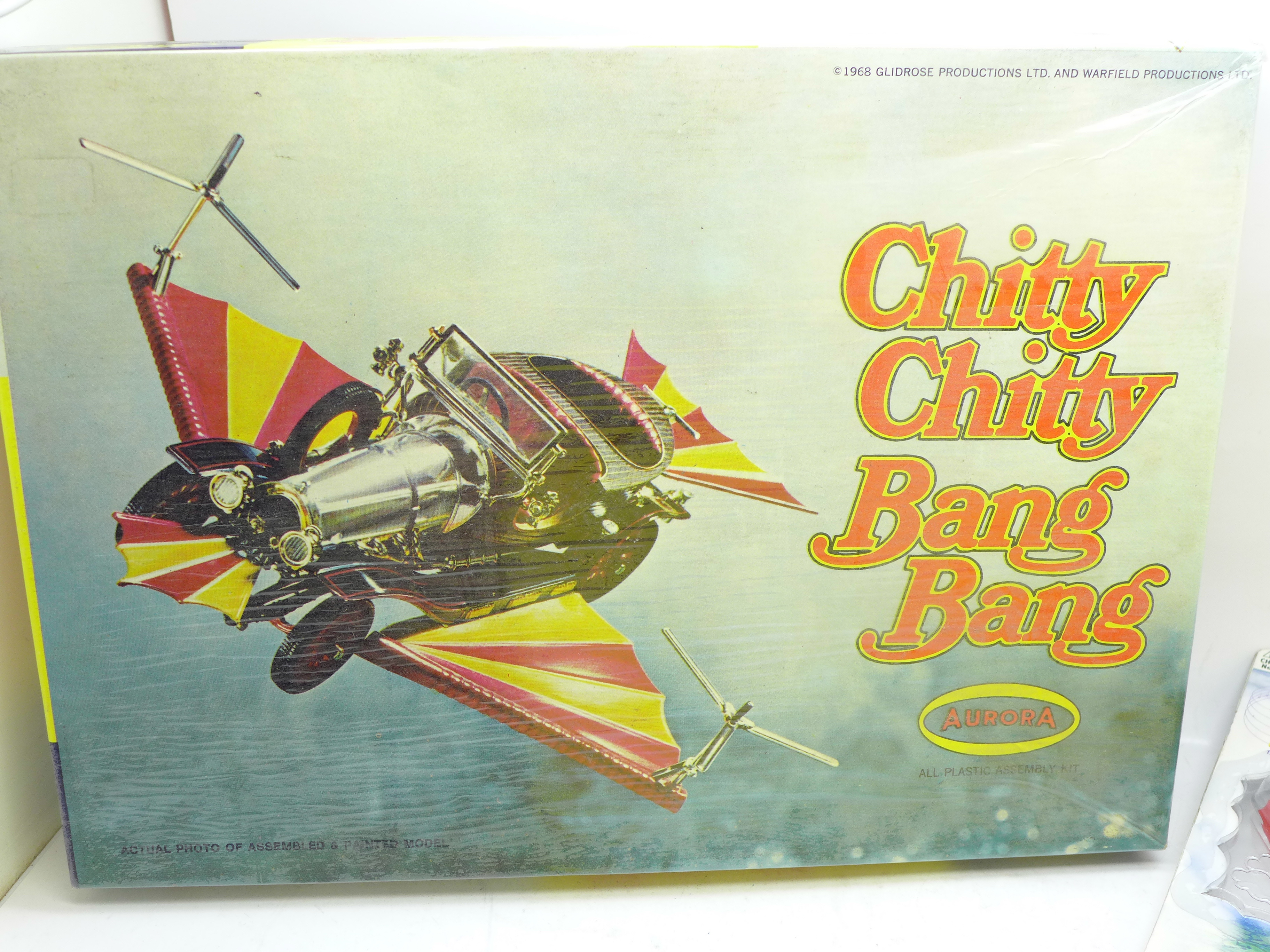 A Chitty Chitty Bang Bang poster, an Aurora model kit, a Corgi Toys model, a/f, and one other - Image 2 of 6