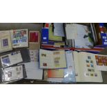 A box of stamp albums, loose stamps, stamp catalogues, etc.