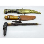 An inlaid Jambyia dagger, a Swedish knife and a carved horn umbrella handle in the form of a