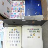 A box of worldwide stamps in four albums and loose albums, etc.