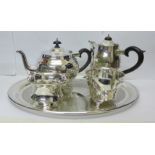 A three piece plated Thomas Wilkinson & Sons tea service comprising teapot, cream and sugar, a