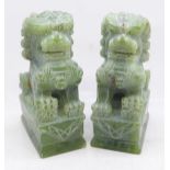 Two carved jade dogs of foe, 12cm
