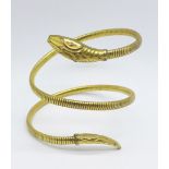 A rolled gold snake bangle