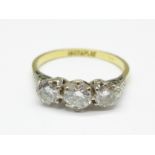 An 18ct gold, three stone diamond ring, approximately 1.2carat total diamond weight, 2.7g, O