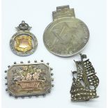 A Victorian silver brooch, a silver fob, etc.