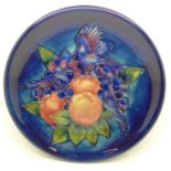 A Moorcroft Finches plate, on a blue ground, 26cm, boxed