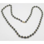 A gold and hematite bead necklace, the clasp marked 14kt