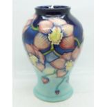 A Moorcroft Cymbidium limited edition vase, designed by Anji Davenport, dated 2001, numbered 21/