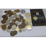 Mixed foreign coins, four commemorative coins and a Guinness coin