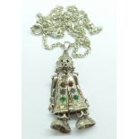 A silver articulated clown pendant and chain