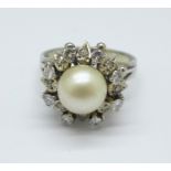 A diamond and pearl set cocktail ring, marks to outside of shank, 6.5g, N