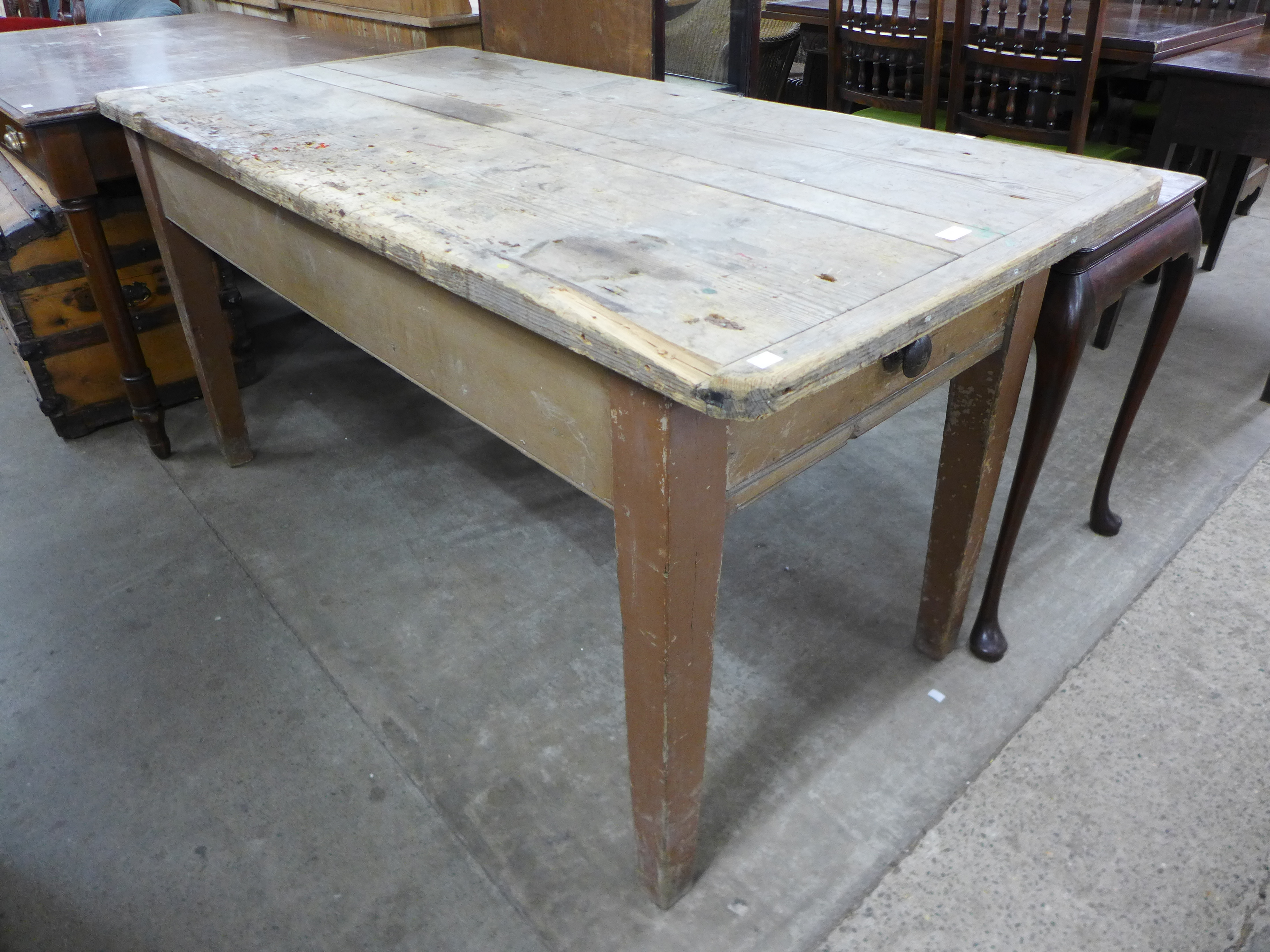 A pine single drawer kitchen table