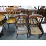 A set of four Victorian elm seated kitchen chairs and another similar
