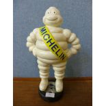 A reproduction cast iron Michelin Man figure