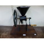 A cast iron grinder by Zachariah Parkes