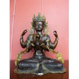 An oriental bronze figure of a deity