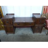 A Regency inlaid mahogany breakfront serving table