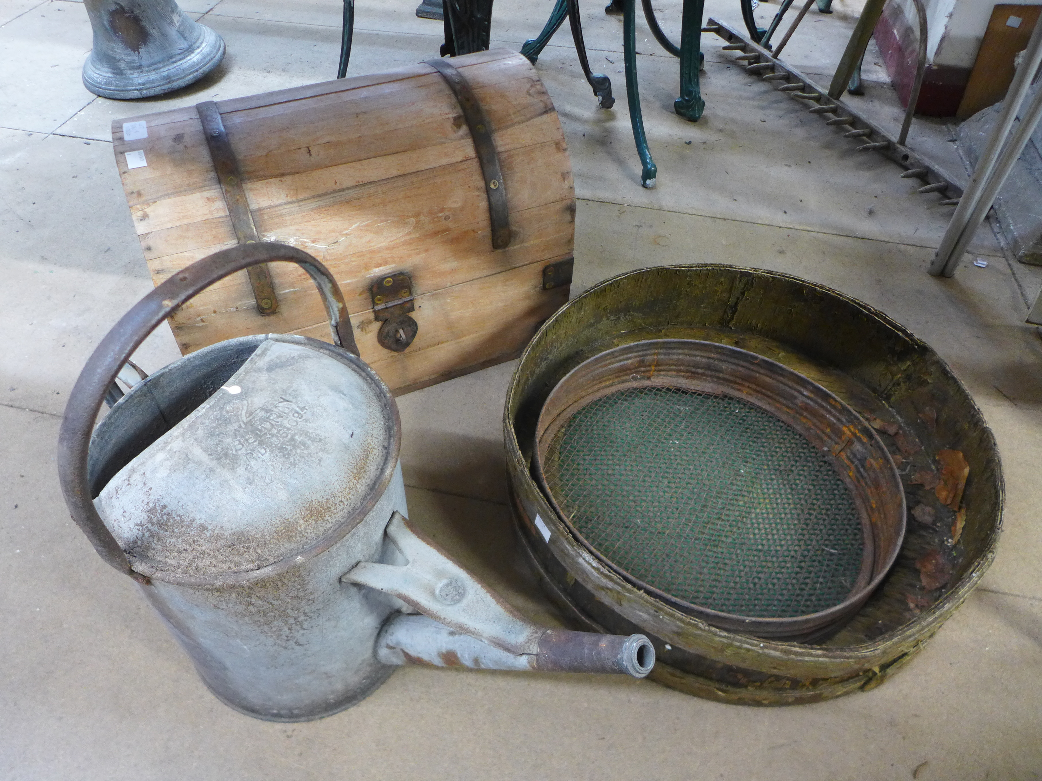 A dome top trunk, galvanised watering can, two sieves, etc.