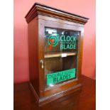 A mahogany table top shop cabinet bearing Clock Blade inscription