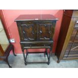 An oak barleytwist cupboard on stand