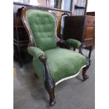 A Victorian mahogany and upholstered armchair