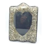 A silver fronted heart shaped photograph frame