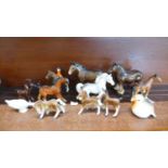 A collection of animal figures, mainly horses, one a/f