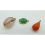 Three yellow metal embellished pendants, coral, quartz and green stone