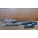 An O gauge locomotive, a Hornby OO gauge locomotive and an Airfix locomotive and tender